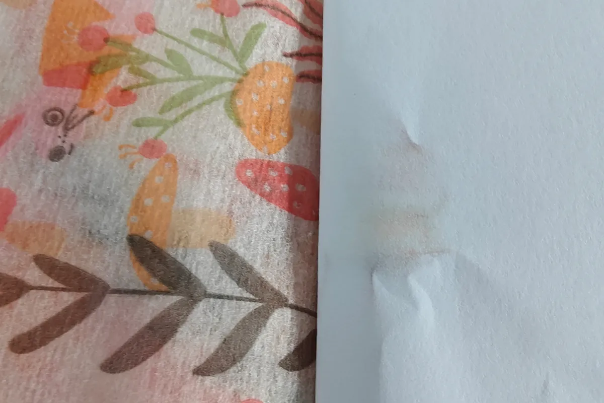 Non woven fabric rubbed with printing paper